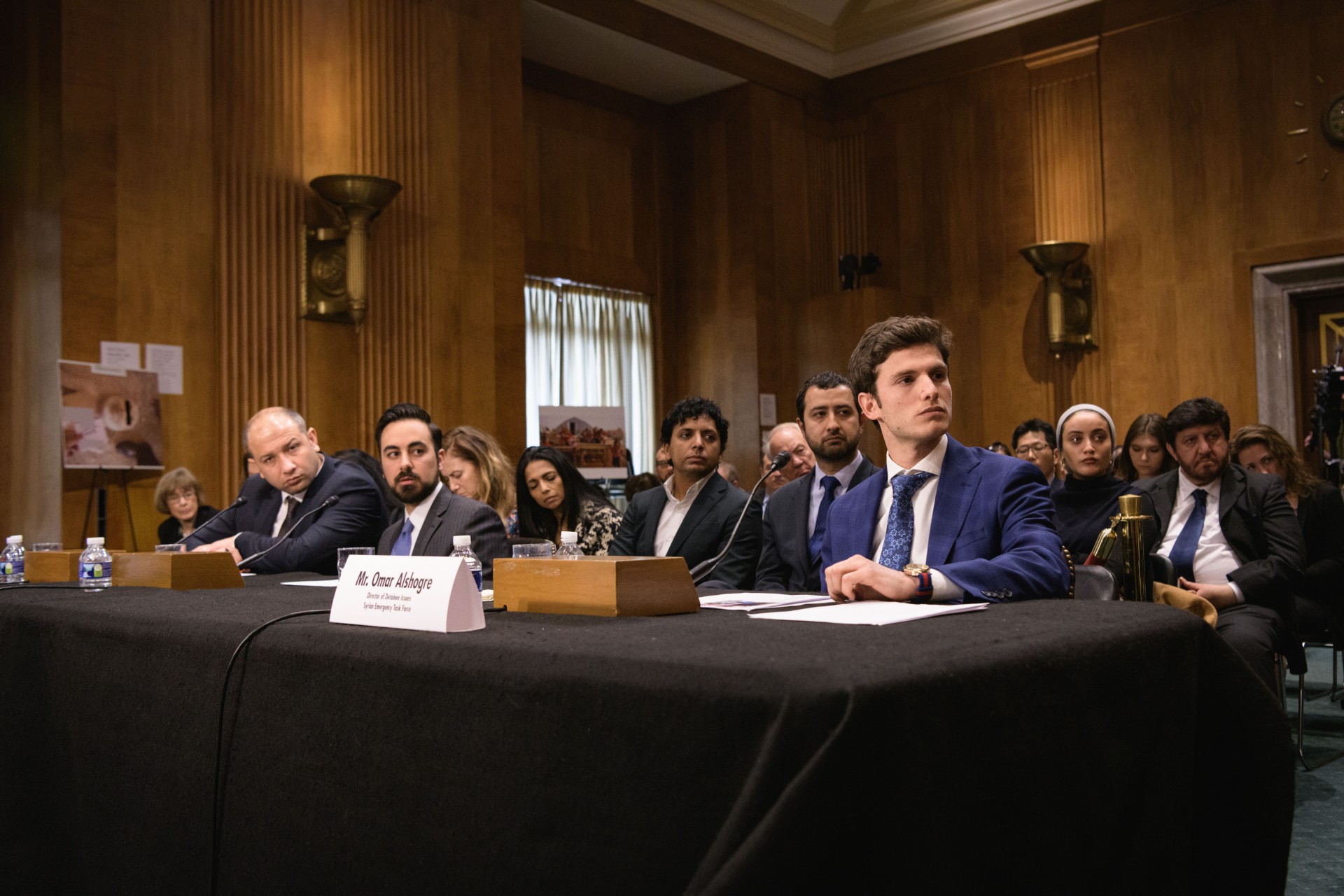 panel in meeting with committee